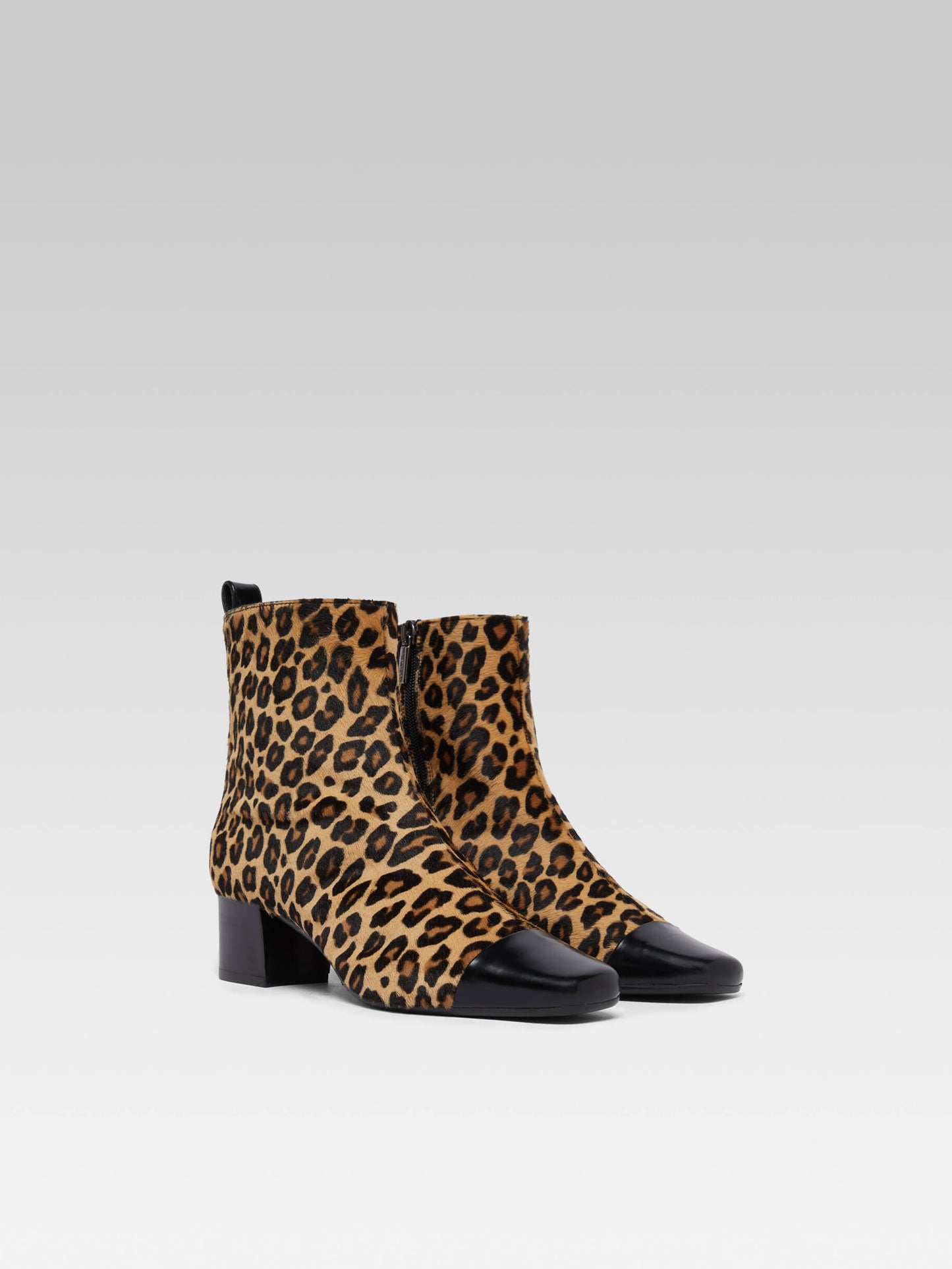 Estime - Upcycled leopard pony leather and black glossy leather ankle boots