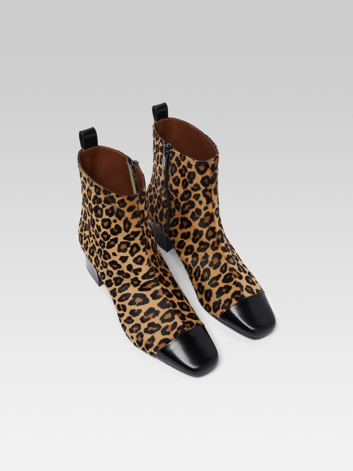 Estime - Upcycled leopard pony leather and black glossy leather ankle boots
