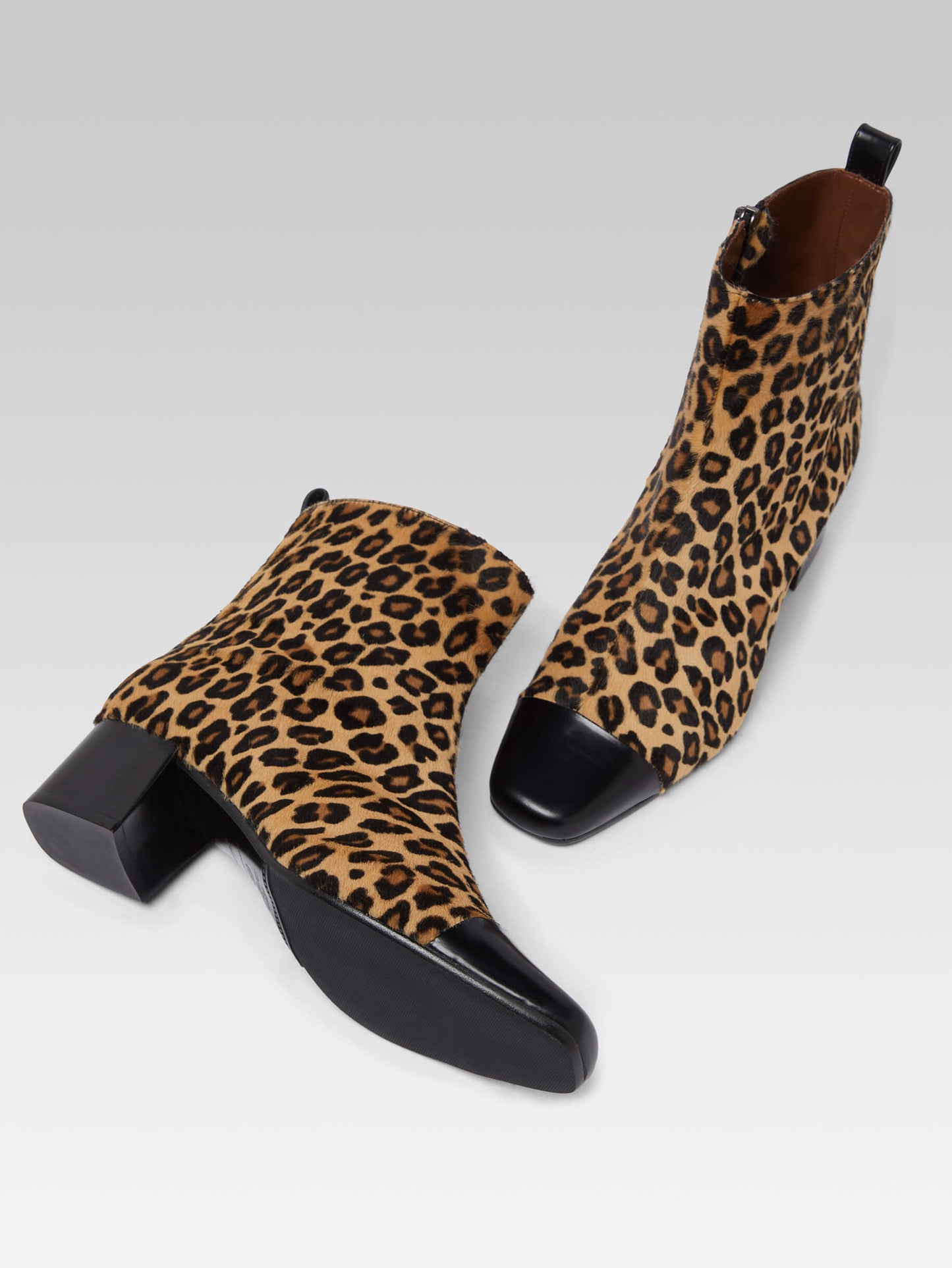 Estime - Upcycled leopard pony leather and black glossy leather ankle boots