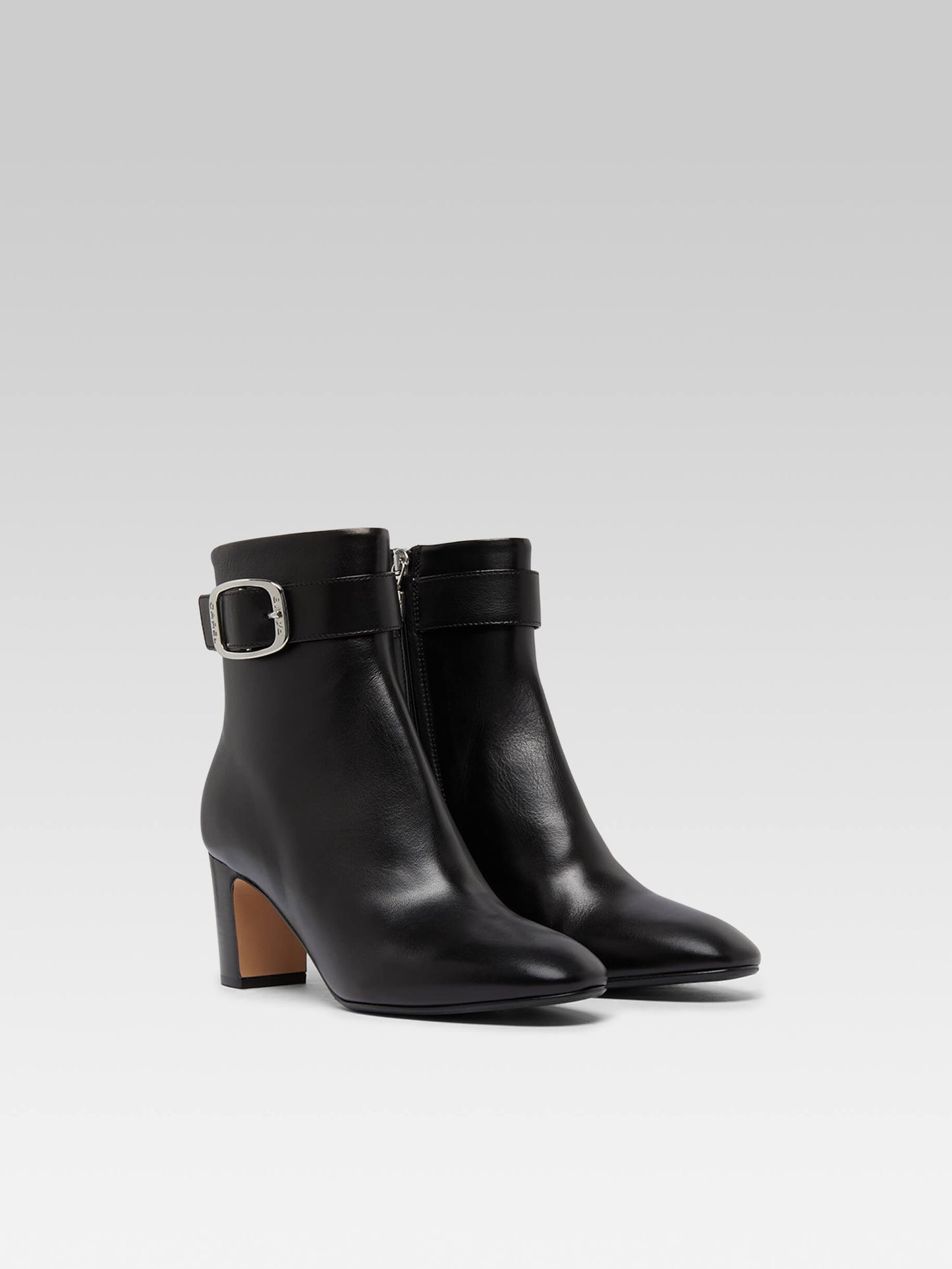 Thelma - Black leather ankle boots with buckle
