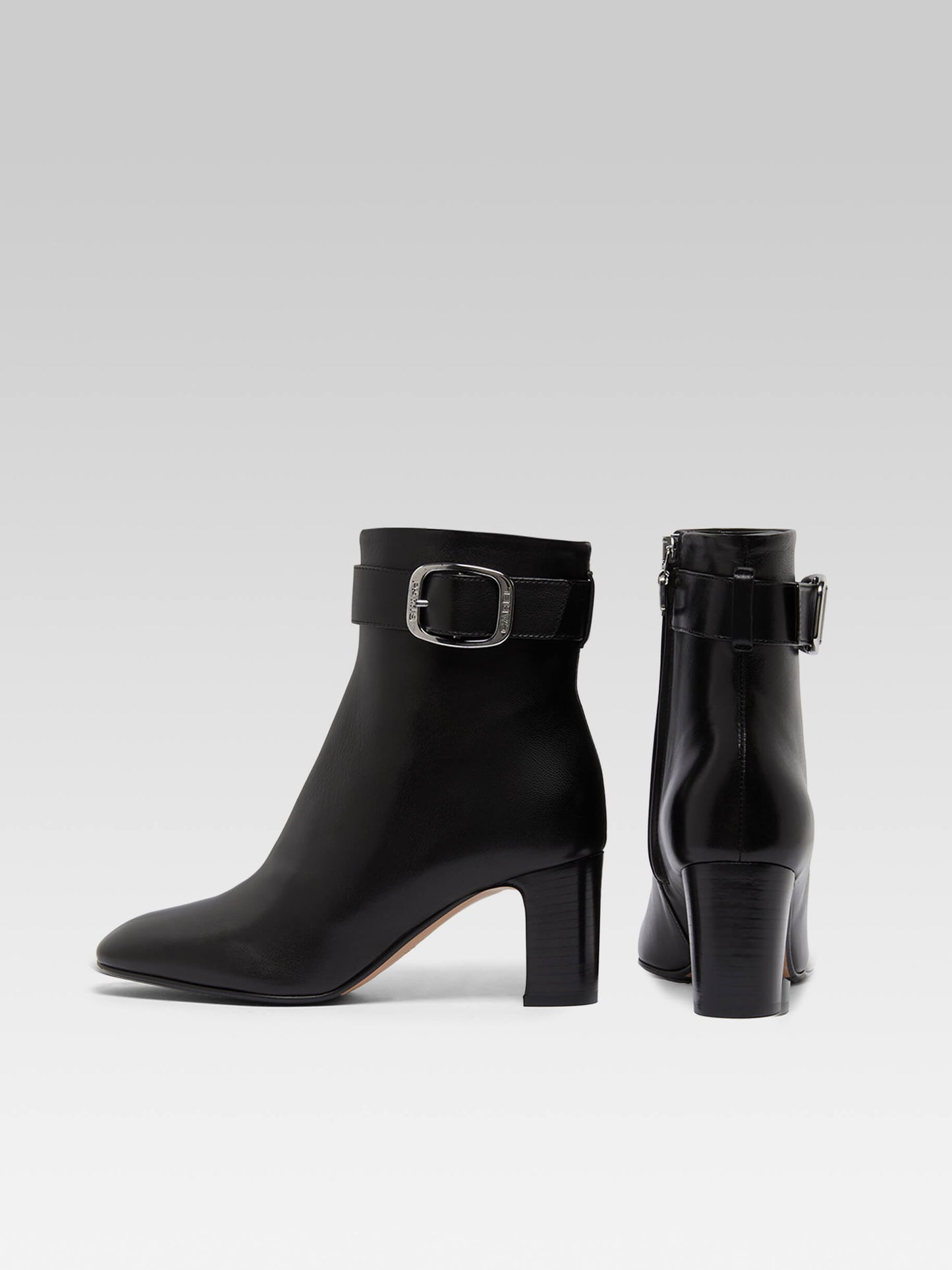 Thelma - Black leather ankle boots with buckle