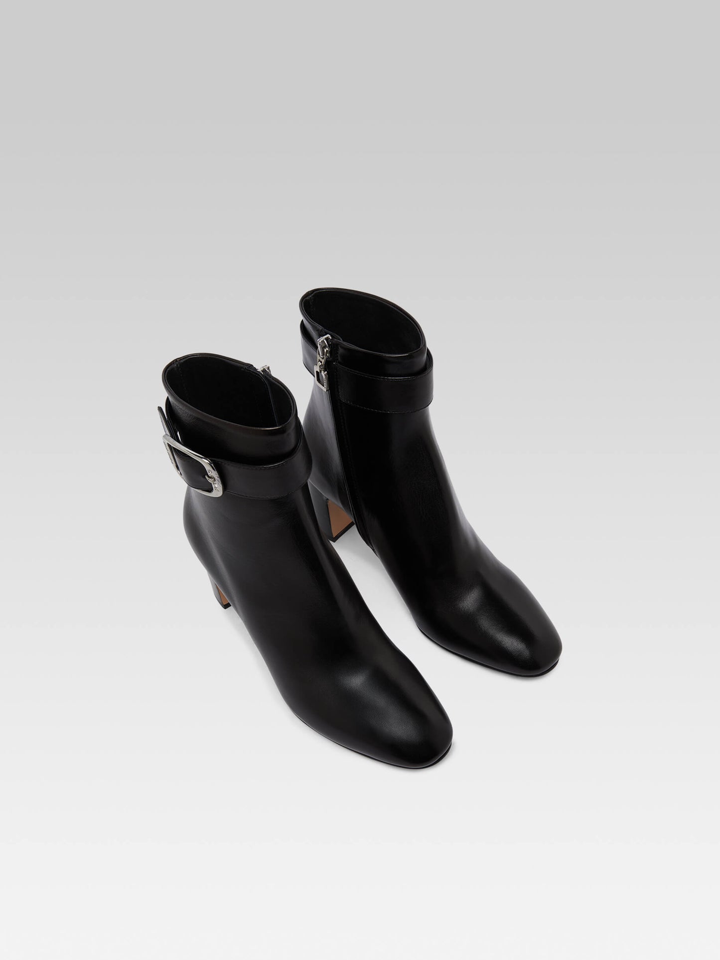 Thelma - Black leather ankle boots with buckle