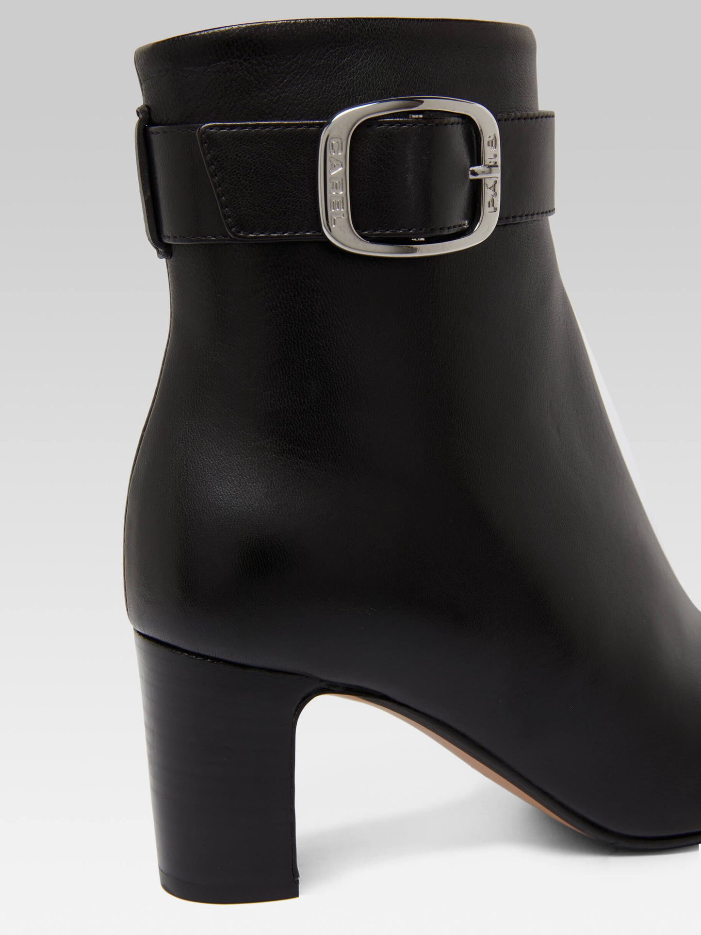 Thelma - Black leather ankle boots with buckle