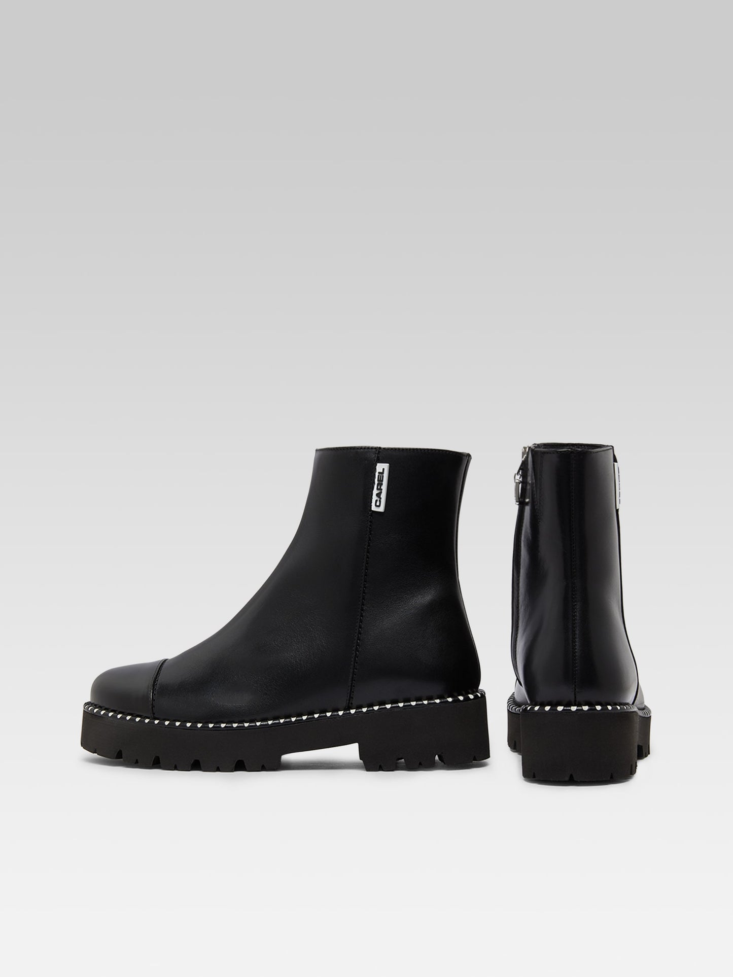 Chouchou - Black leather and glossy leather ankle boots with stitching