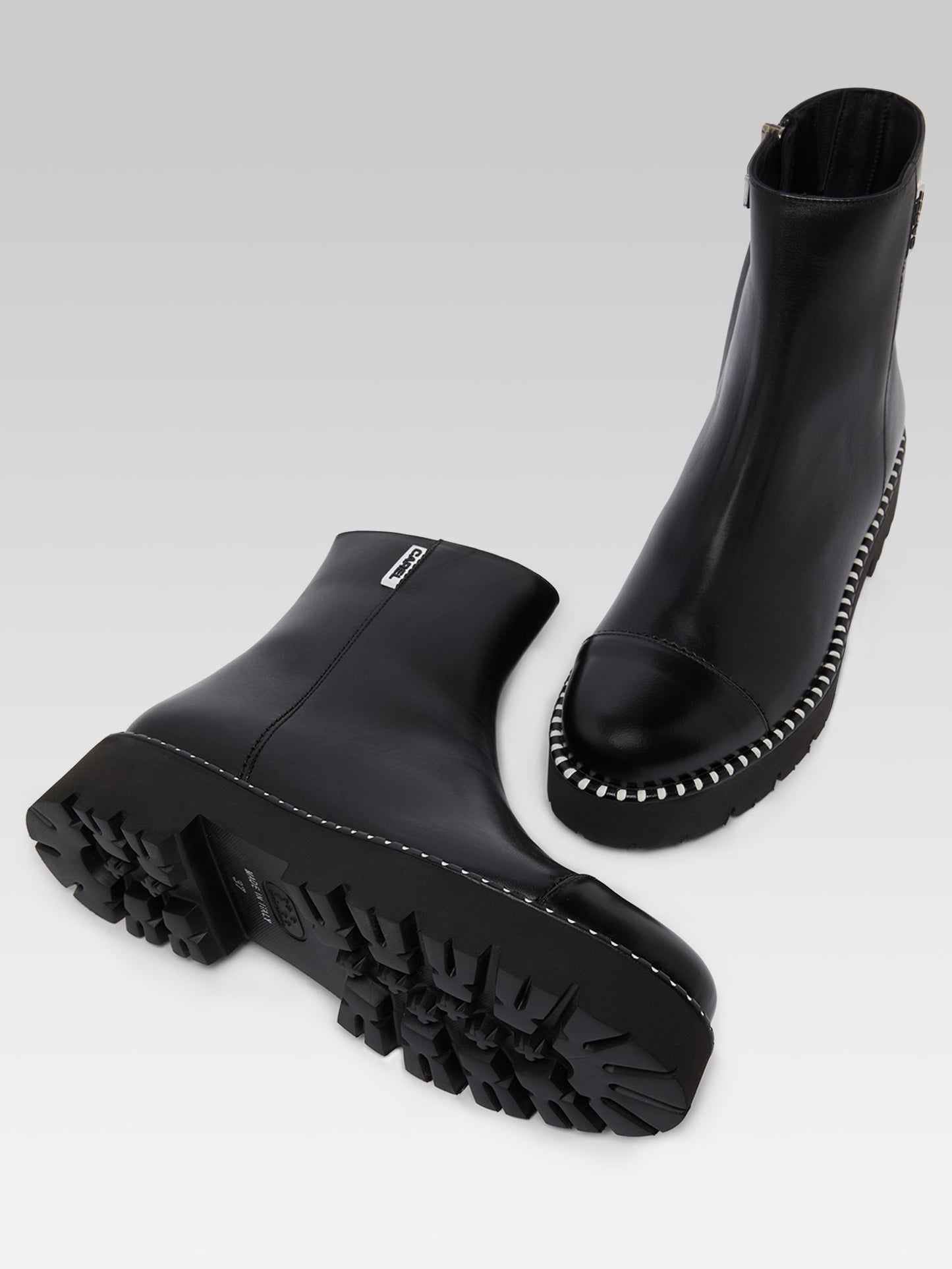 Chouchou - Black leather and glossy leather ankle boots with stitching