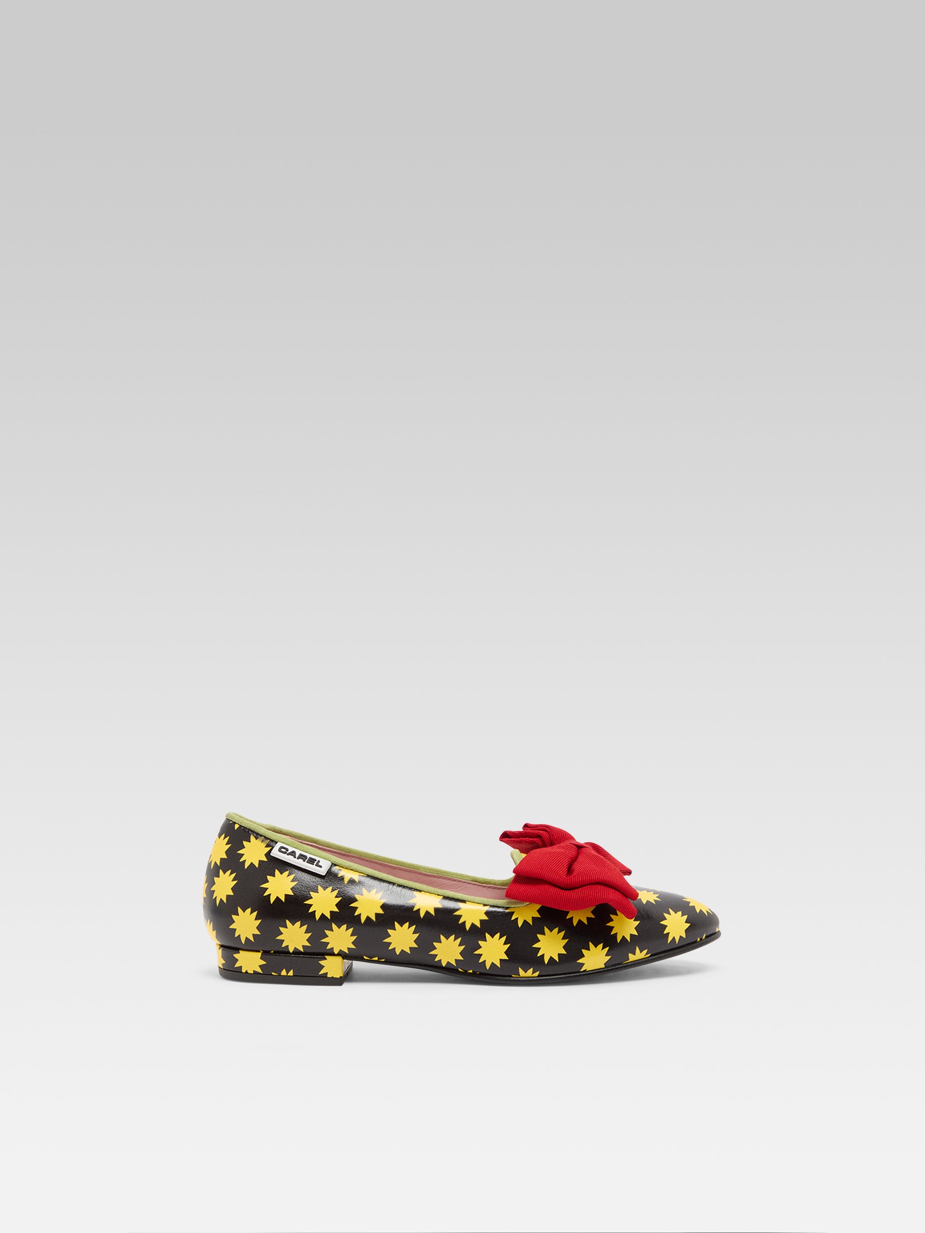 Star M - Black leather ballet flats with yellow stars and a red bow - Image number 1